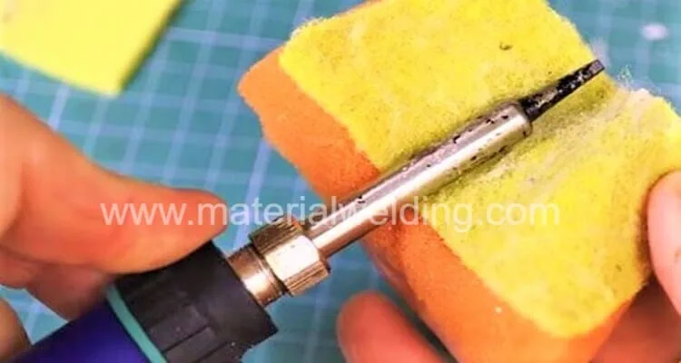 clean soldering iron tip with sponge